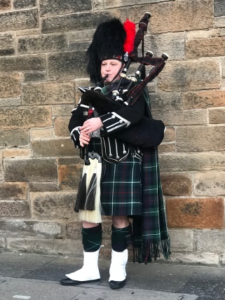 A Scotsman playing the bagpipes!